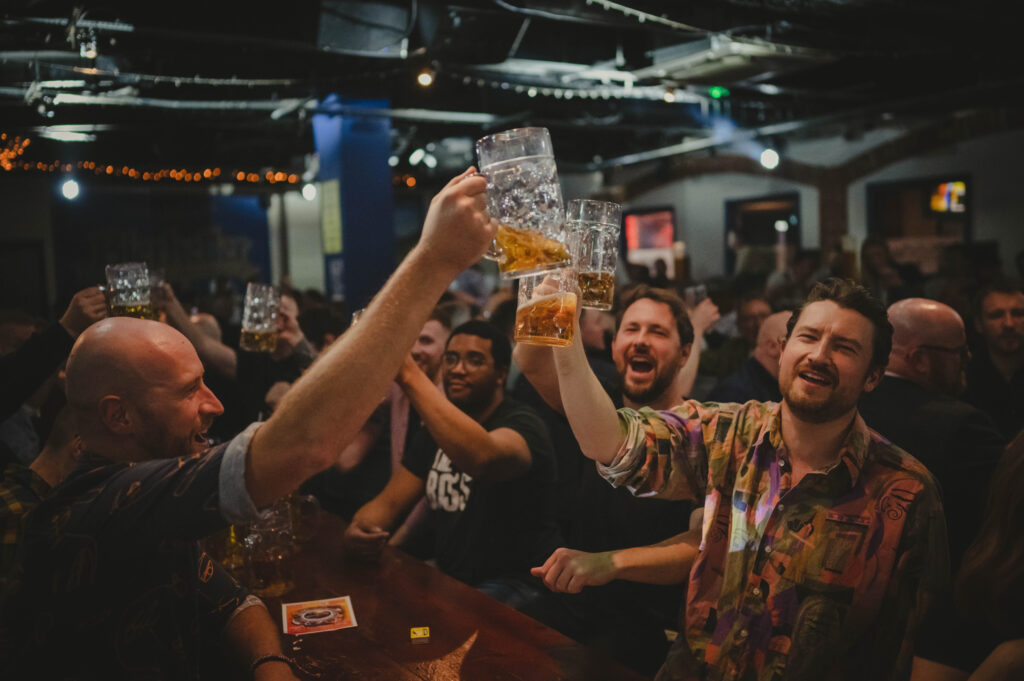 group of men toasting with steins